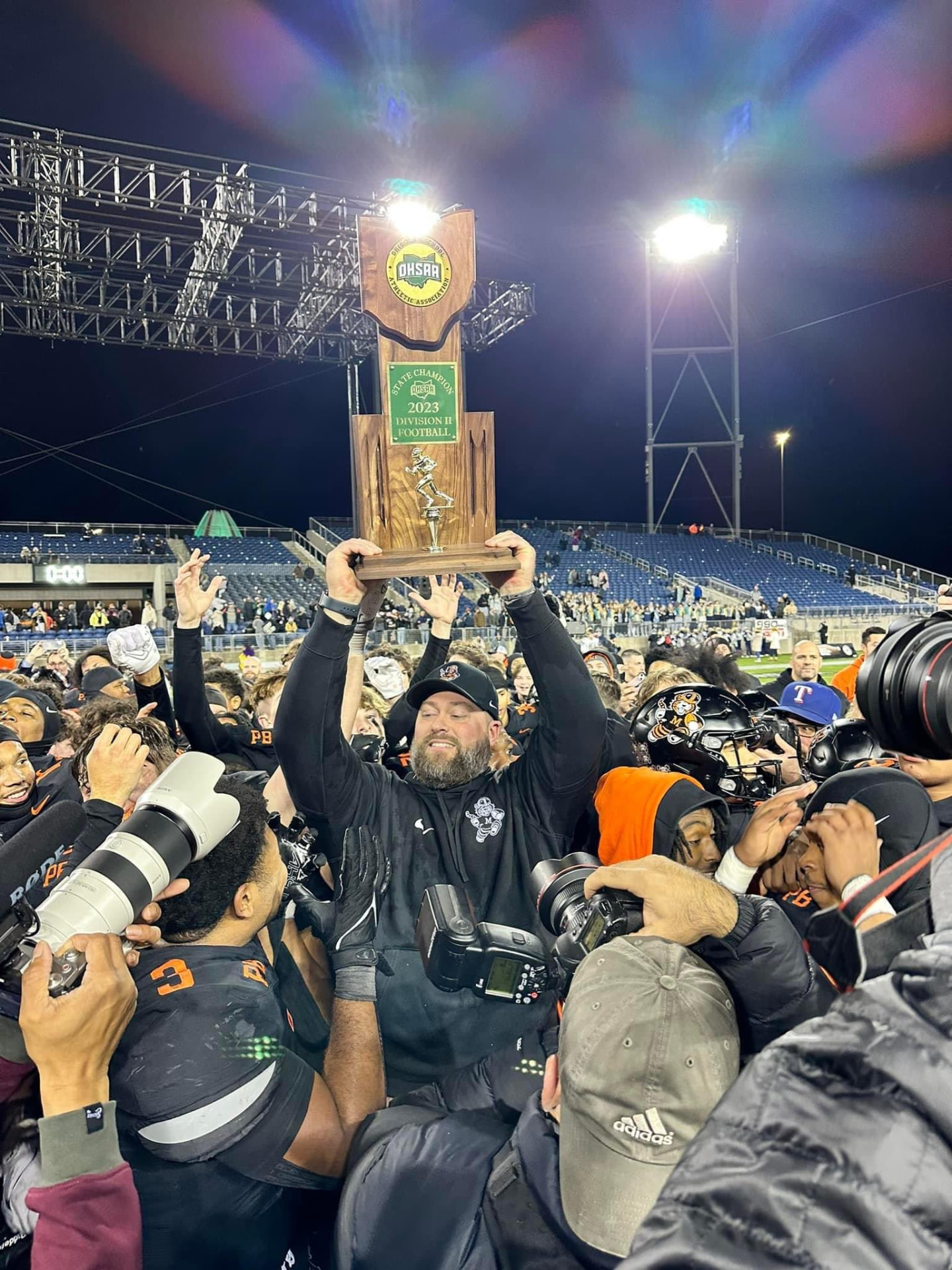 Hoisting the 2023 Division II state title trophy