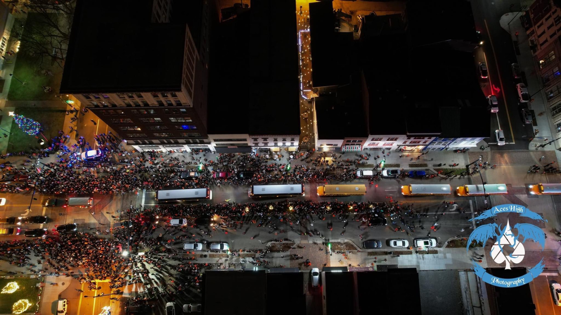 Aerial view of the team buses and the crowd downtown