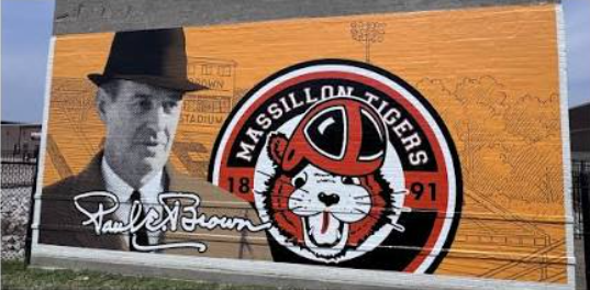 Paul Brown signature mural — his name in script, the 1891 Tigers emblem, and the stadium in line