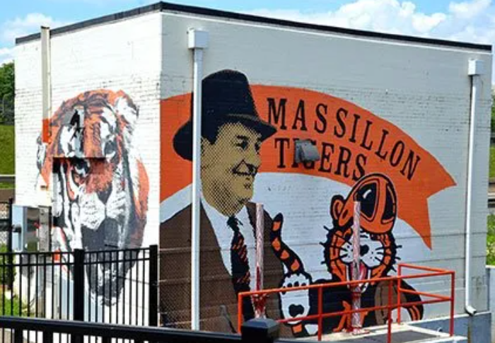 Massillon Tigers wall — Paul Brown in his fedora, Obie, and a roaring tiger